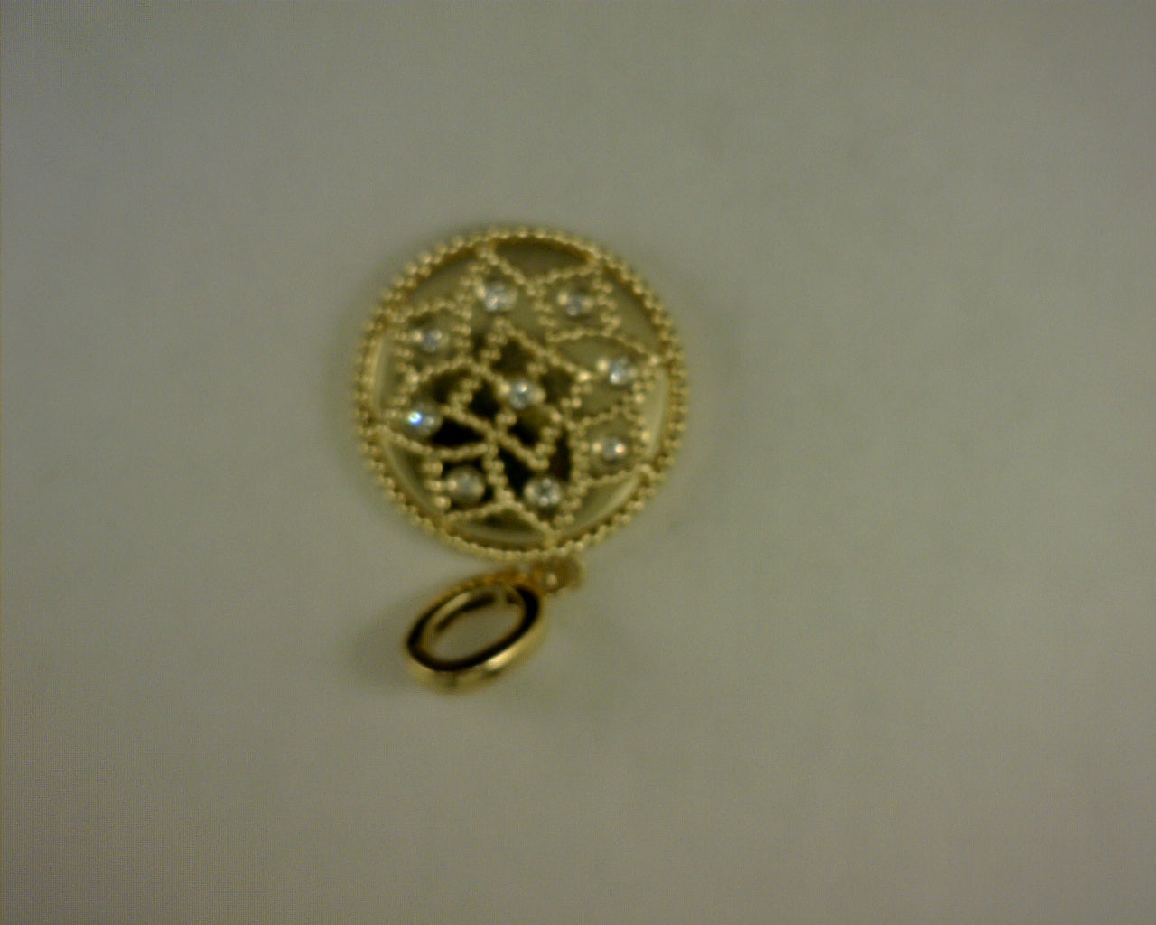 14 KARAT YELLOW GOLD BUJUKAN DIAMOND MEDALLION 18MM s1778461