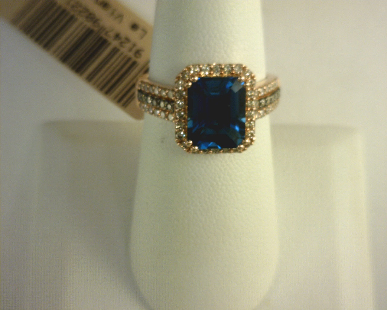 Le Vian® Ring featuring 3 1/2 cts. Deep Sea Blue Topaz™, 1/2 cts. Nude Diamonds™, 1/10 cts. Chocolate Diamonds® set in 14K Strawberry Gold®
