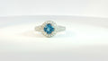 White 18 Karat Milgrain Contemporary Ring With 84=0.63Tw Round G/H Si1 Diamonds And One 6.00X6.00Mm Round Blue Topaz