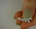 14 KARAT WHITE GOLD DIAMOND GRADUATING MARQUISE SHAPE STUD