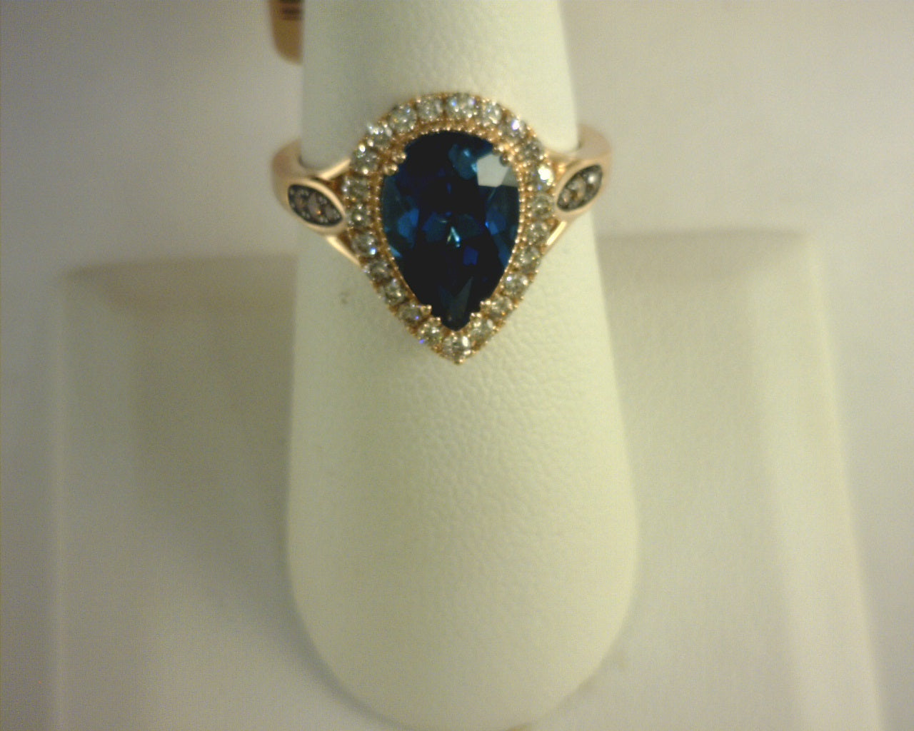 Le Vian® Ring featuring 3 cts. Deep Sea Blue Topaz™, 1/10 cts. Chocolate Diamonds®, 3/8 cts. Nude Diamonds™ set in 14K Strawberry Gold®