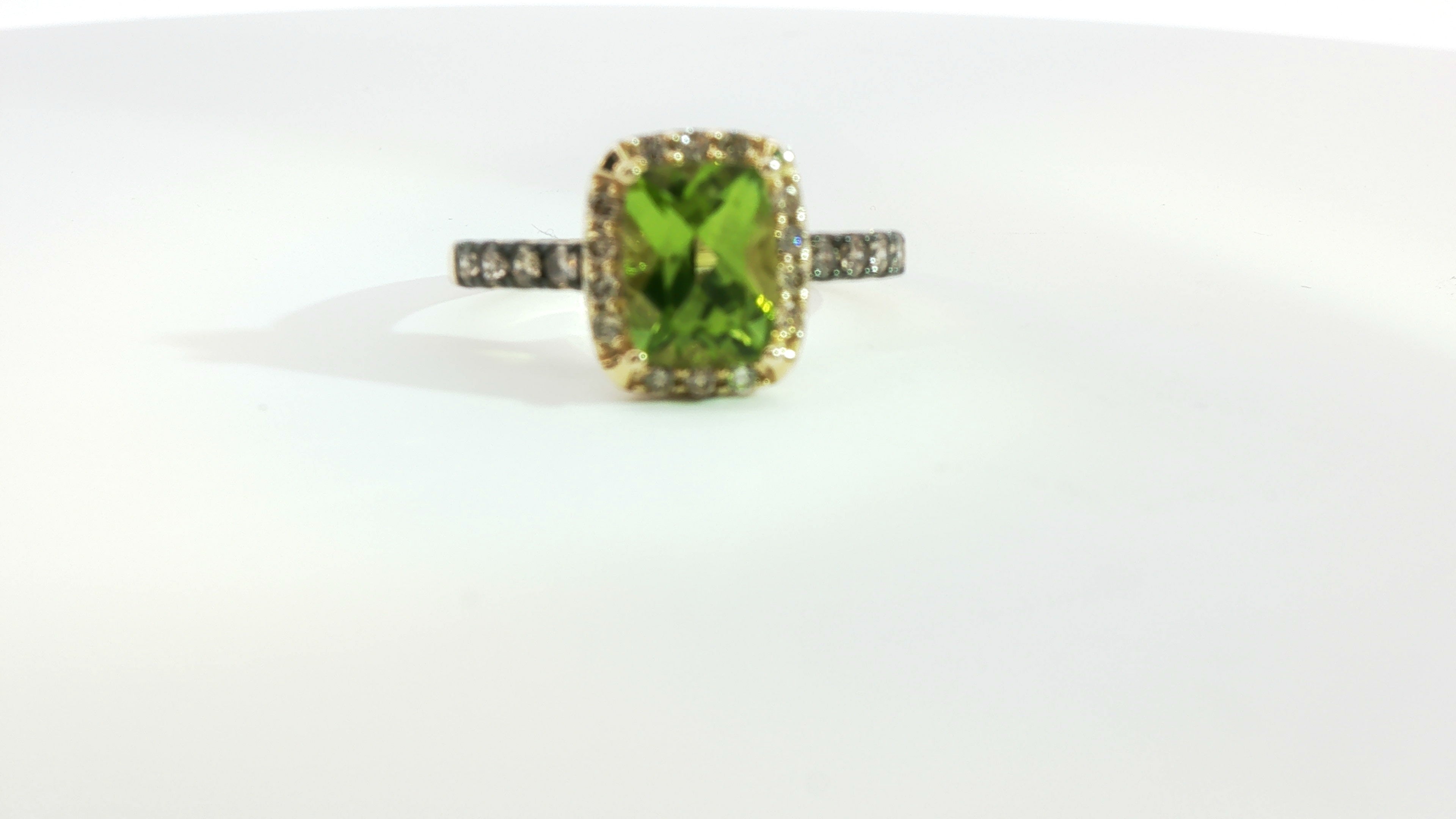 Le Vian® Ring featuring 1 1/2 cts. Green Apple Peridot™, 1/5 cts. Chocolate Diamonds®, 1/6 cts. Nude Diamonds™ set in 14K Honey Gold™