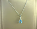10KW DIAMOND AND BLUE TOPAZ PENDANT