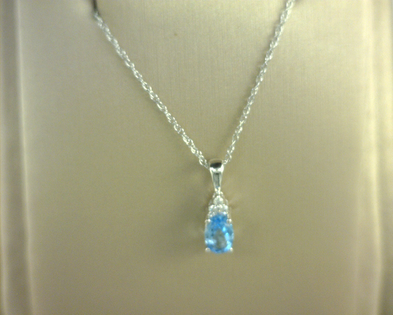 10KW DIAMOND AND BLUE TOPAZ PENDANT