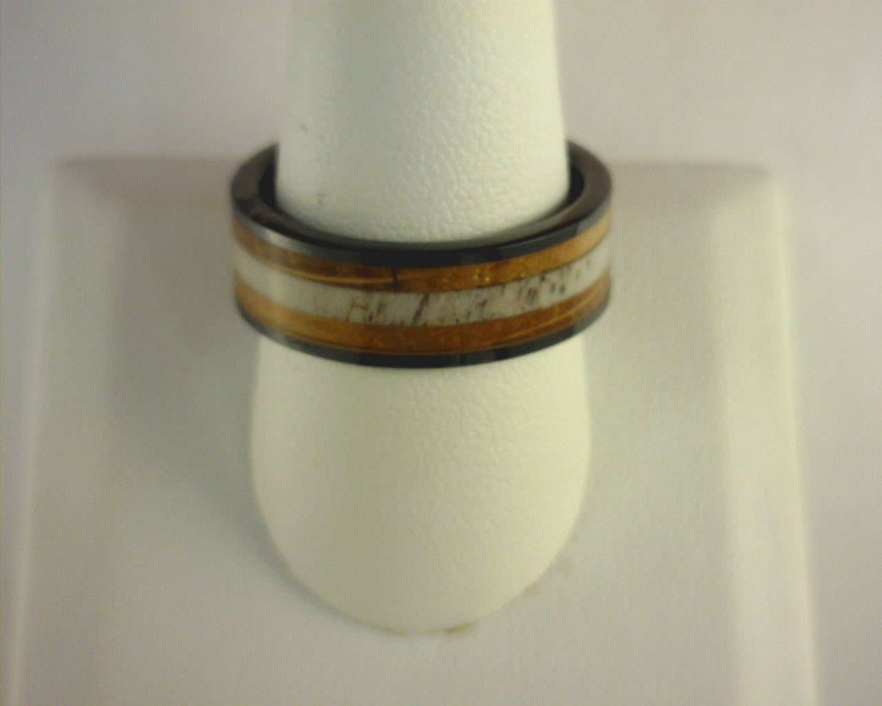 Steel Revolt GAMBLER is an 8 mm Tennessee Whiskey ring made with cigar leaf and wood from barrels once used by the Jack Daniel's Distillery.