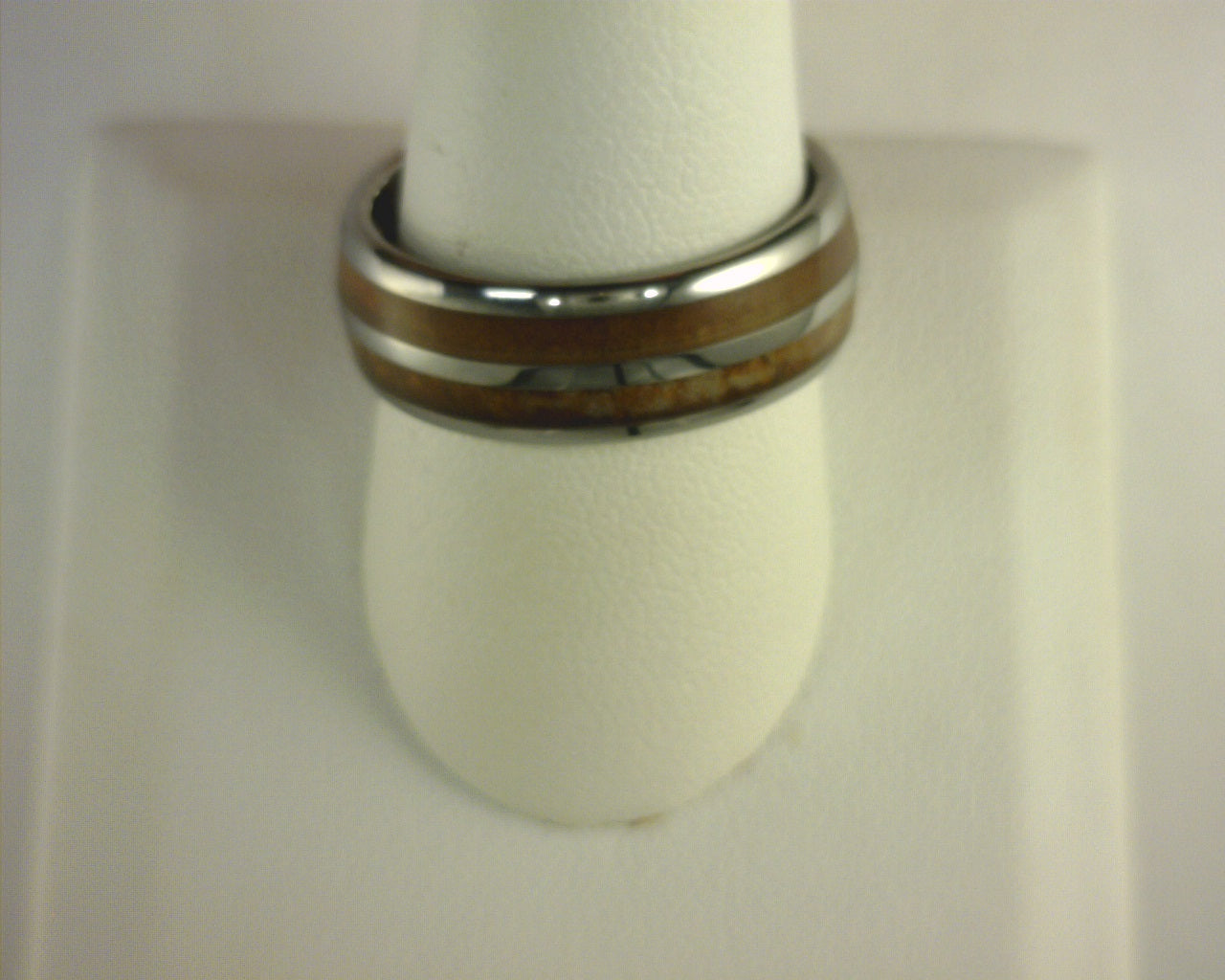 Steel Revolt GAMBLER is an 8 mm Tennessee Whiskey ring made with cigar leaf and wood from barrels once used by the Jack Daniel's Distillery.