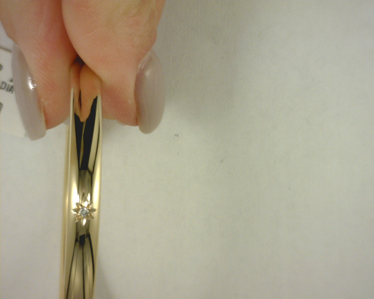 14 KARAT YELLOW GOLD BANGLE WITH GENUINE DIAMOND