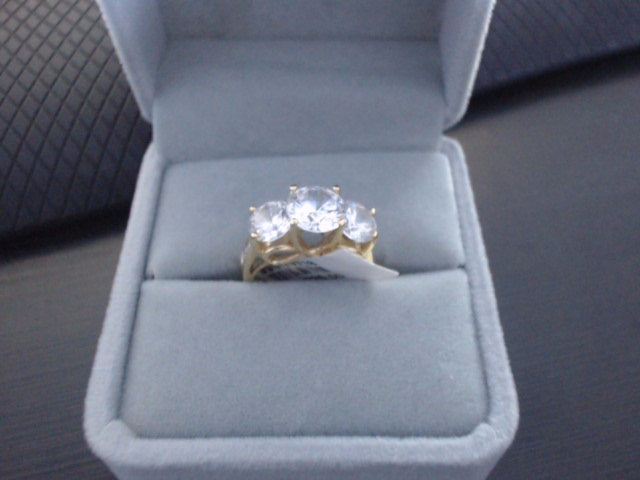 Yellow 14 Karat Ring With 7= Round Cubic Zirconiums<br>FINAL SALE