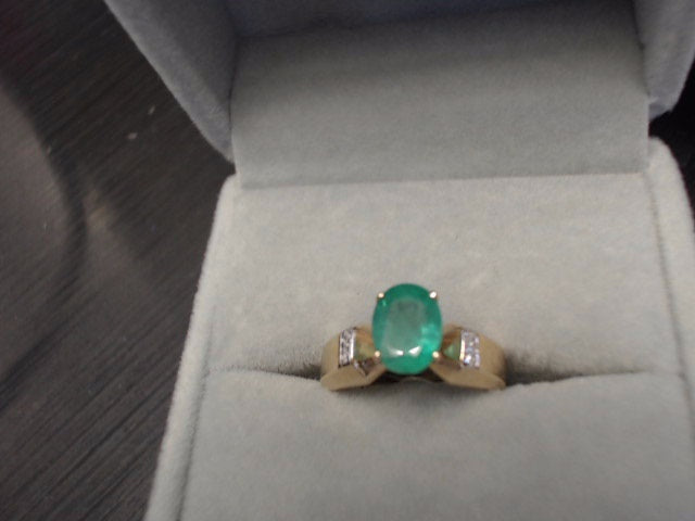 Yellow 14 Karat Ring With One 1.20Ct Oval Emerald And 4=0.04Tw Round Diamonds<br>FINAL SALE