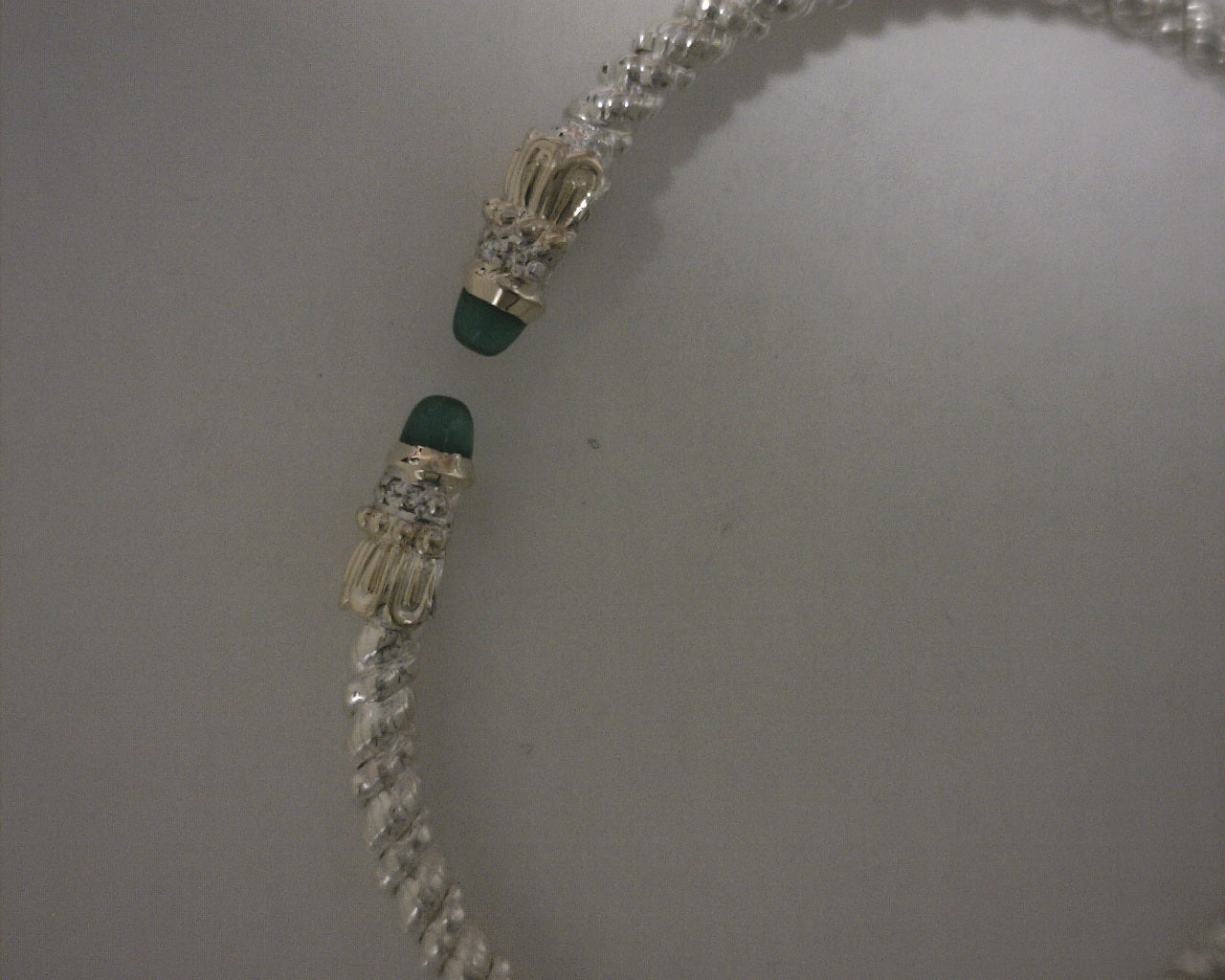 ss cuff with 14 karat gold and diamonds with emerald caps 2 3/8