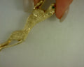 14 KARAT YELLOW GOLD JAGUAR BROACH  WITH EMERALD EYES .5MM EMERALDS .16 TCW