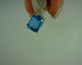 14 karat 3 diamond and blue topaz pendant