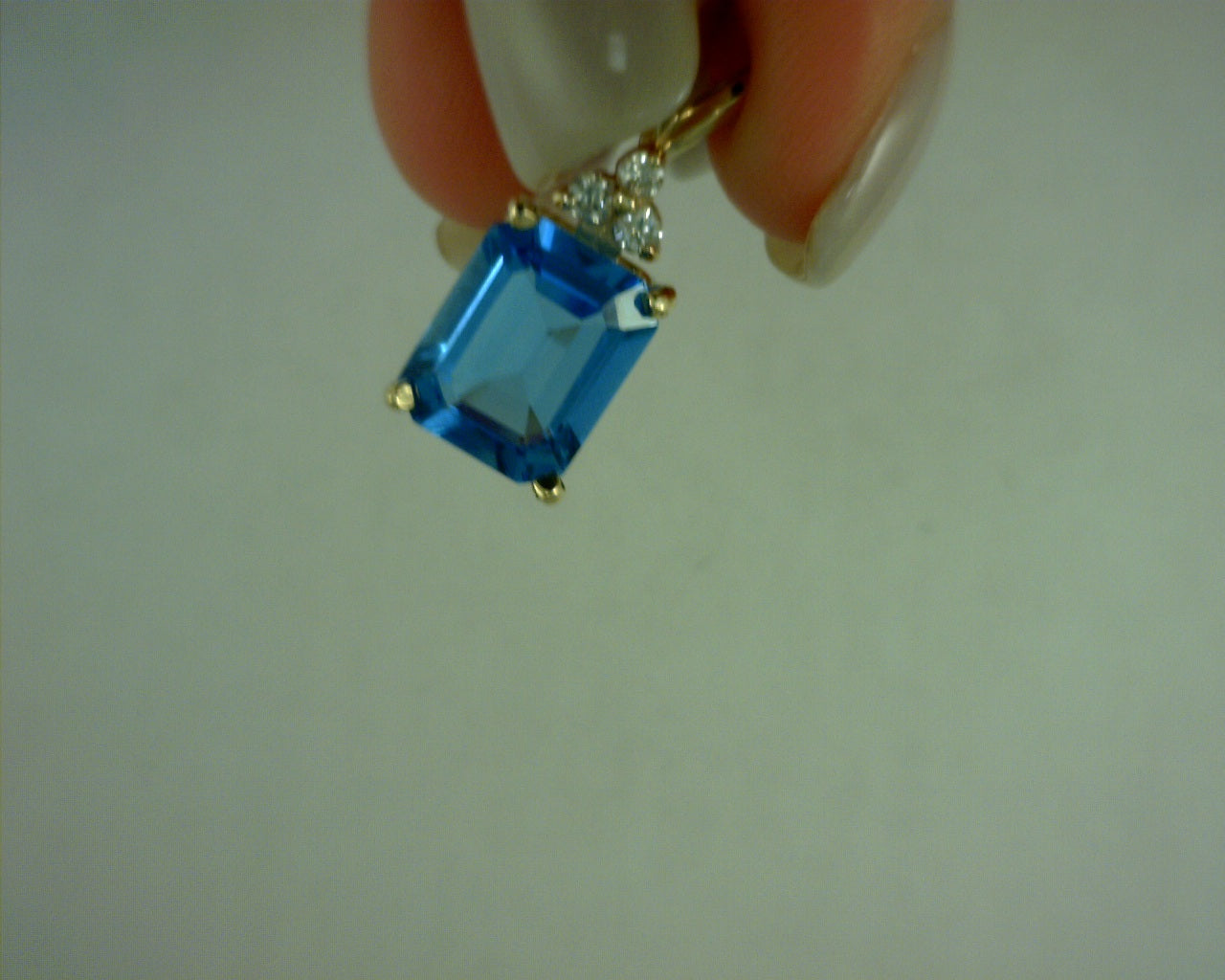 14 karat 3 diamond and blue topaz pendant