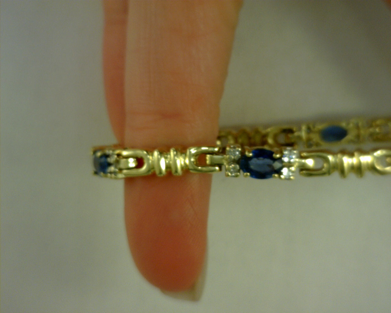 18 karat yellow gold diamond and sapphire bracelet