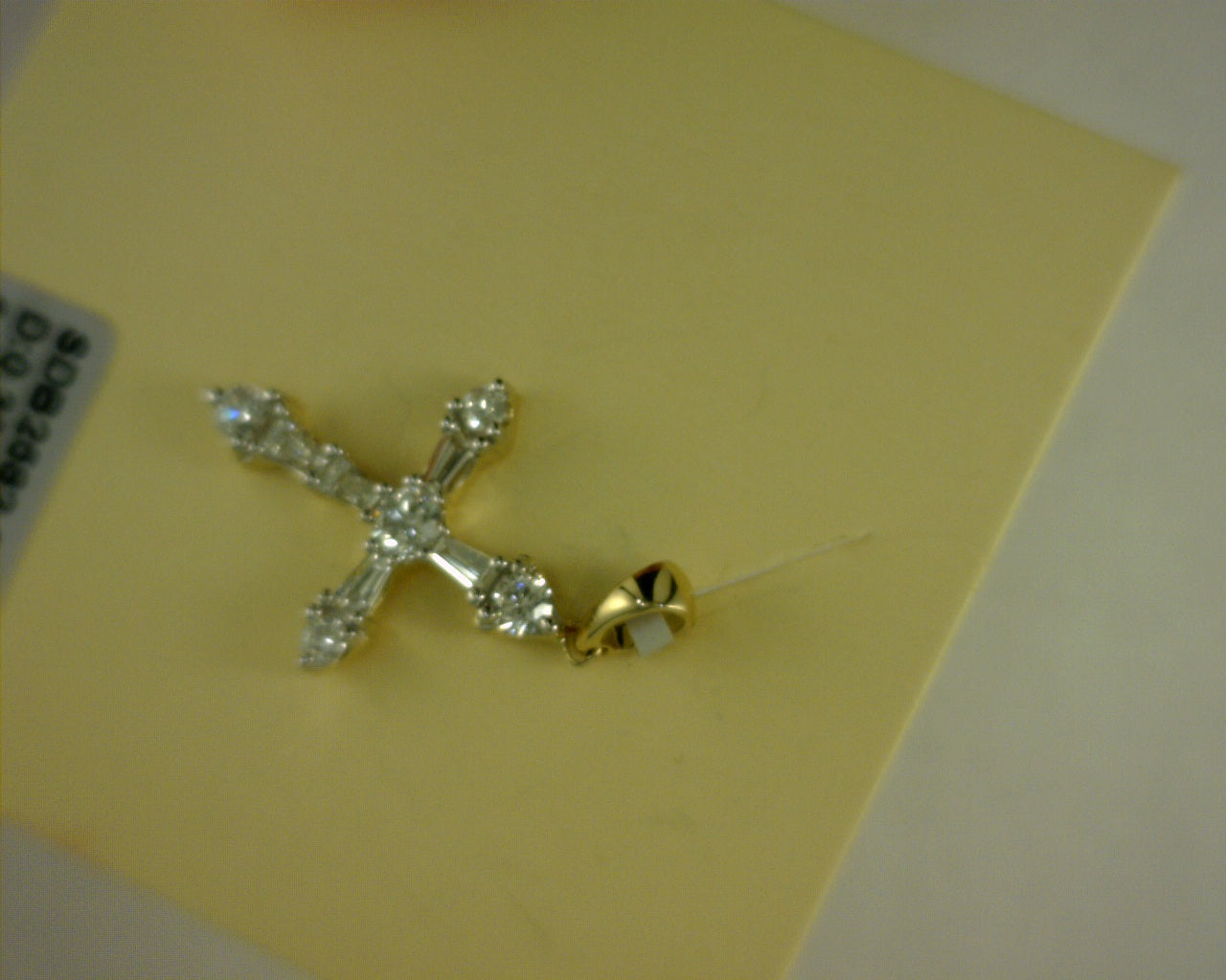 14 KARAT YELLOW GOLD DIAMOND CROSS 0.671 TCW