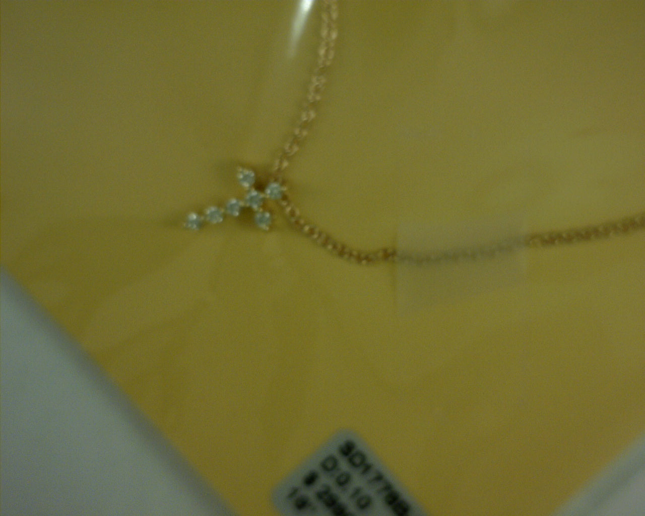 14 KARAT YELLOW GOLD 0.1 TCW DIAMOND CROSS
