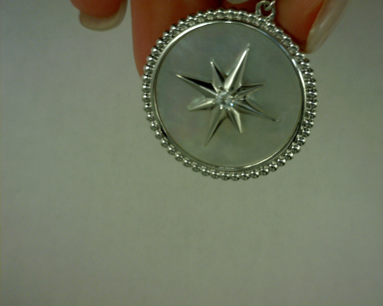 STERLING SILVER BUJUKAN AND WHITE SAPHIRE MOTHER OF PEARL MEDALLION
