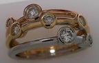 14 KARAT TROL COLOR BEZEL DIAMOND SET RING