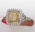 Platinum 1.57 ctw Diamond Ring<br><br><br><br>.10 yellow diamonds (small) <br>.47 white diamonds<br>1.00 center yellow diamond