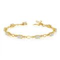 10K Yellow Gold Oval Blue Topaz and Diamond Bracelet